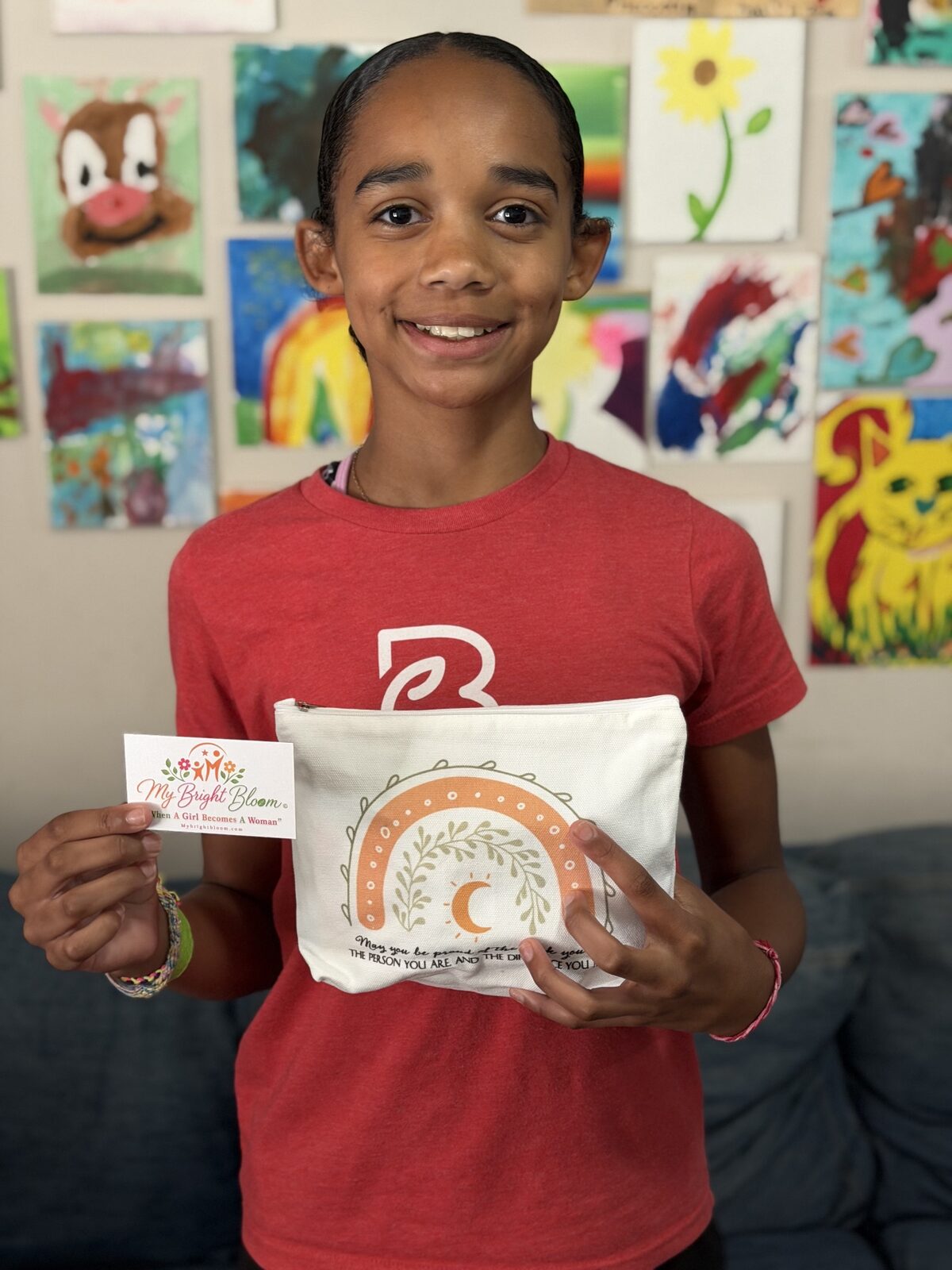 Girl smiling while holding her My Bright Bloom kit